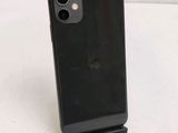 the back of an iphone 11 with a black case on a white surface
