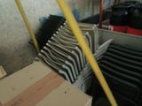 a lot of chairs that are stacked up in a room