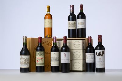 several bottles of wine sitting on top of a table next to a box