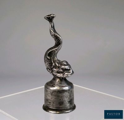 an image of a sculpture of a bird on top of a glass table