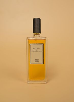 a bottle of perfume sitting on top of a table