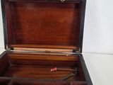 a small wooden box with a handle on top of it