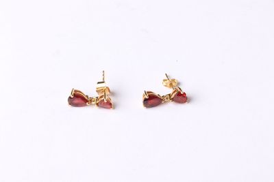 gold plated earrings with garnets and garnets on them