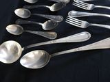 a lot of spoons and spoon spoons on a table
