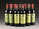 six bottles of red wine are lined up in a row