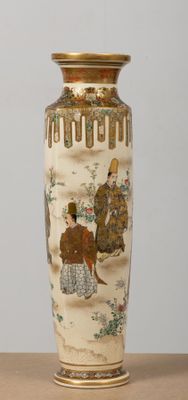 a vase with a painting on it sitting on a table