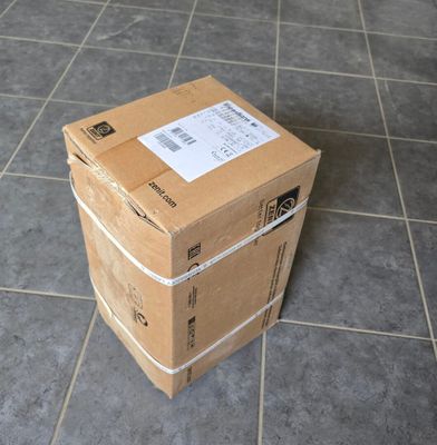 boxes stacked on top of each other on a tiled floor