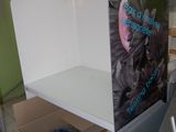 a refrigerator that is sitting in the middle of a room