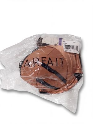 a close up of a basketball in a plastic bag on a white background