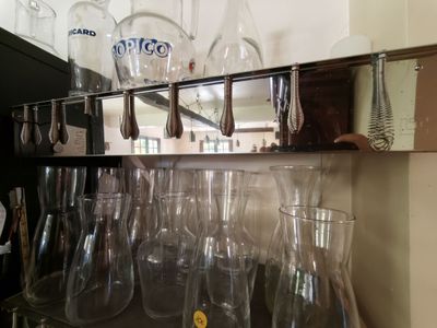 a shelf with a bunch of wine glasses on it