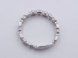 a close up of a ring on a table with a white background