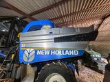 a blue tractor with a new holland logo on it