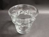 a glass vase that has been placed on a table