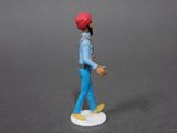 figurine of a man with a red hat and blue pants