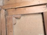 a picture of a wooden door with a hole in it