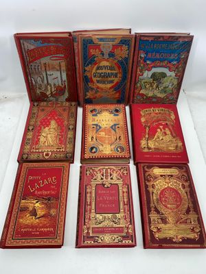 a group of six books sitting on top of a white surface