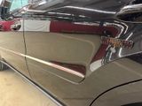 a close up of a car door handle with a sticker on it