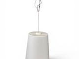 an image of a white lamp with a wooden base on a white surface