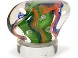 a glass vase with a green and red design on it