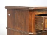 a wooden desk with a drawer on top of it