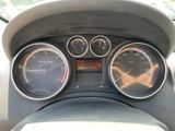 a close up of a car dashboard with gauges and speedometers