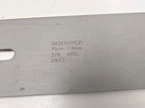 a close up of a metal knife on a white surface