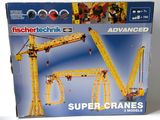a box of lego technics with a crane on it