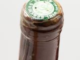 a close up of a bottle of wine on a table