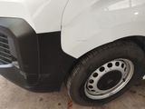 a close up of a white truck with a black stripe