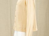 an image of a mannequin mannequin wearing a yellow shirt and white pants