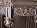 a close up of a wooden table with a clock on it