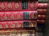 several books stacked on top of each other on a table
