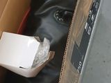 a cardboard box with a white box inside of it