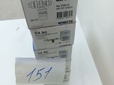 a stack of three boxes sitting on top of a white table