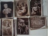 many old photos of people on display in a glass case