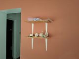 a shelf that has some scissors and other items on it
