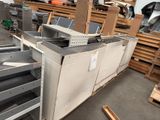 a lot of metal shelves that are stacked together