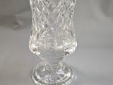 a glass vase that is sitting on a table