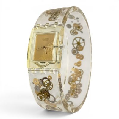 a watch that has gears on it on a bracelet