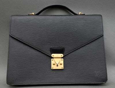 a black briefcase with a gold lock on it