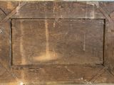 a picture of an old wooden picture frame on the wall