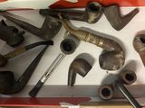 a box full of different types of pipes in it