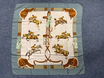 an image of a scarf with horses and jockeys on it