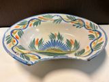 a small bowl with a flower design on it