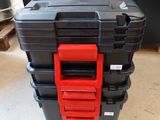 two black and red tool boxes sitting on top of each other