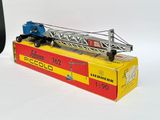 a toy truck with a crane on top of it