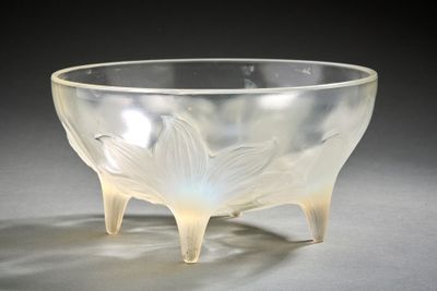 a clear glass bowl with a leaf design on it