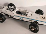 a model of a racing car on a white surface
