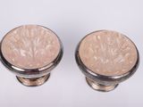 pair of silver and pink marble knobs on a white background