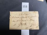 an old piece of paper with writing on it sitting on top of a table